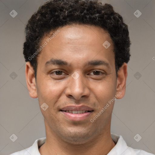 Joyful latino young-adult male with short  brown hair and brown eyes