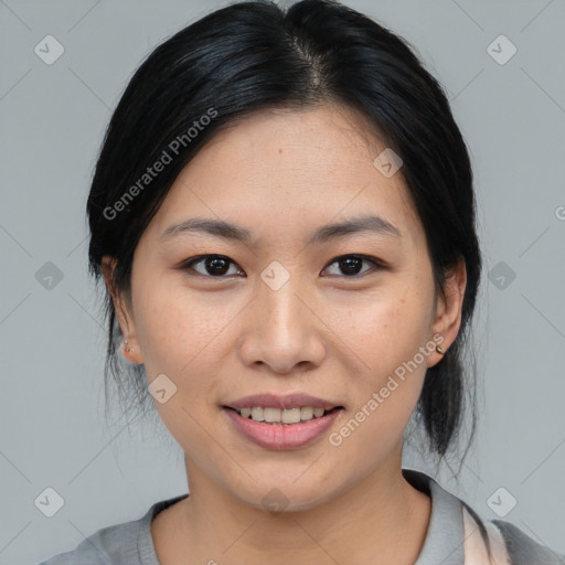 Joyful asian young-adult female with medium  black hair and brown eyes