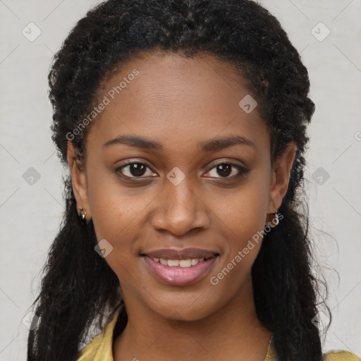 Joyful black young-adult female with long  brown hair and brown eyes