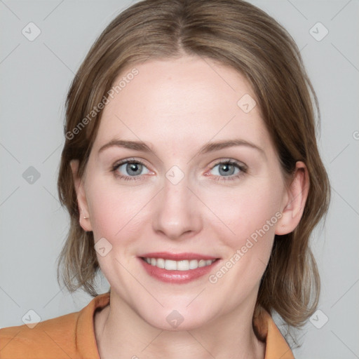 Joyful white young-adult female with medium  brown hair and blue eyes