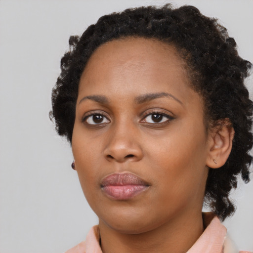 Neutral black young-adult female with medium  black hair and brown eyes