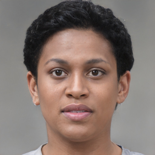 Joyful black young-adult female with short  brown hair and brown eyes