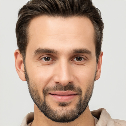 Joyful white young-adult male with short  brown hair and brown eyes