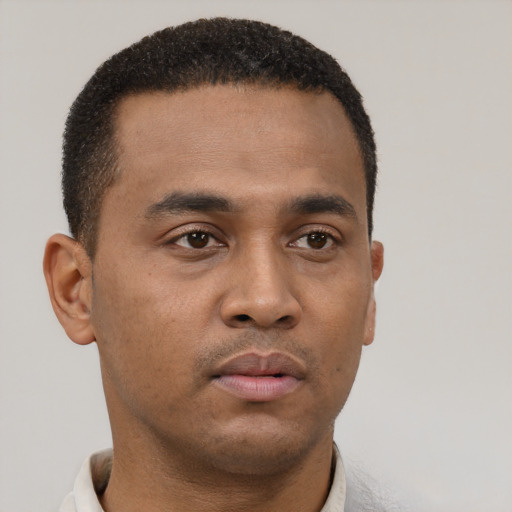 Neutral latino young-adult male with short  brown hair and brown eyes