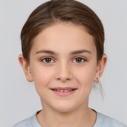 Joyful white child female with short  brown hair and brown eyes