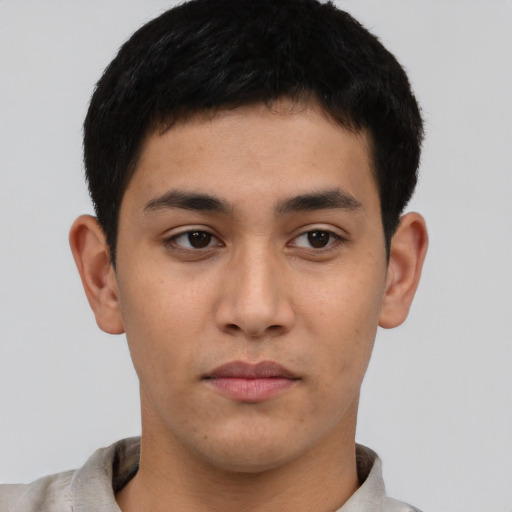 Neutral latino young-adult male with short  brown hair and brown eyes