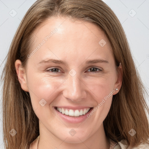 Joyful white young-adult female with long  brown hair and grey eyes