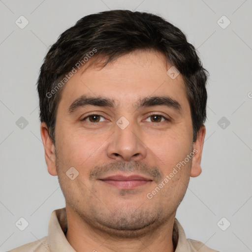 Joyful white young-adult male with short  black hair and brown eyes