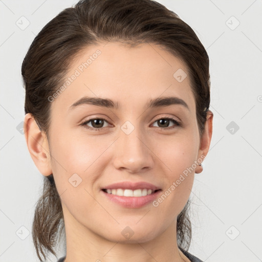 Joyful white young-adult female with medium  brown hair and brown eyes