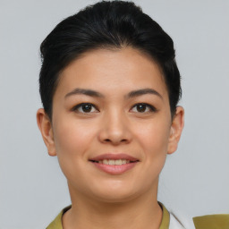 Joyful asian young-adult female with short  brown hair and brown eyes