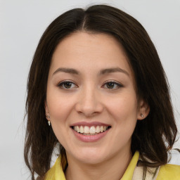 Joyful white young-adult female with medium  brown hair and brown eyes