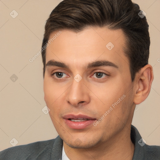 Joyful white young-adult male with short  brown hair and brown eyes