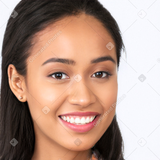 Joyful latino young-adult female with long  brown hair and brown eyes