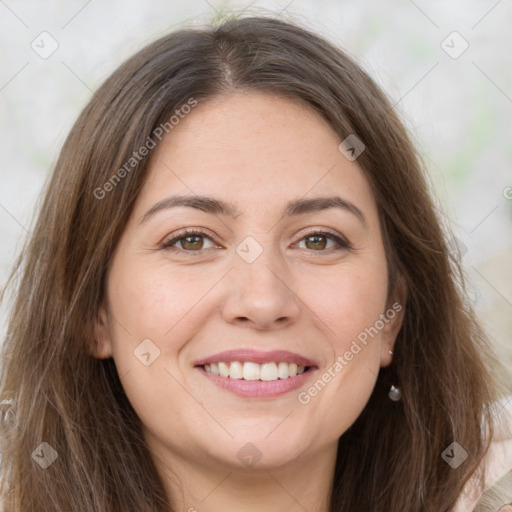 Joyful white young-adult female with long  brown hair and green eyes