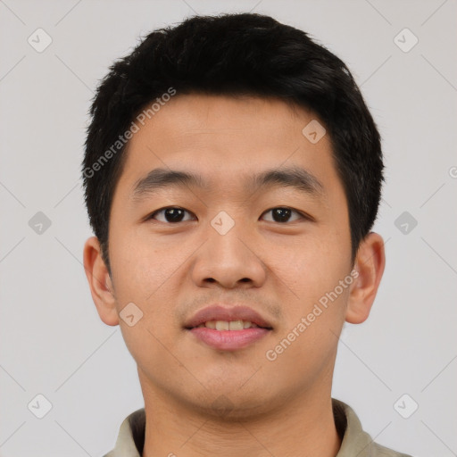 Joyful asian young-adult male with short  black hair and brown eyes