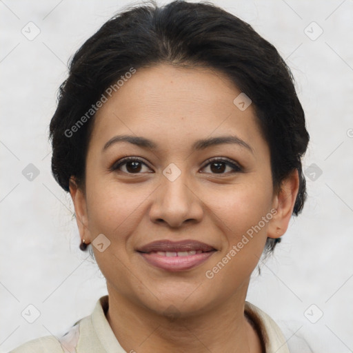 Joyful latino young-adult female with short  brown hair and brown eyes