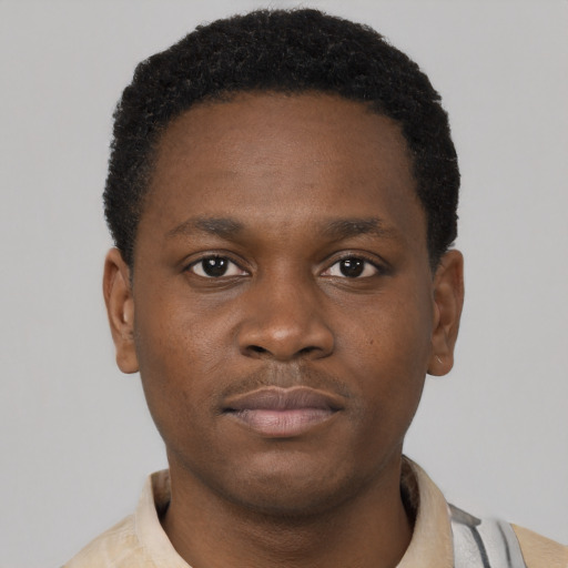 Neutral black young-adult male with short  brown hair and brown eyes