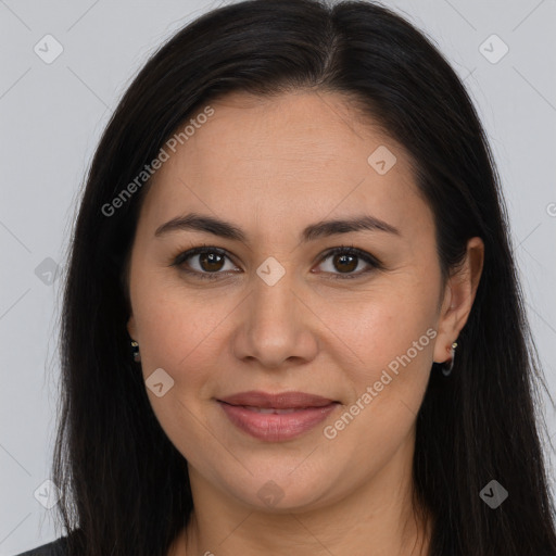 Joyful white adult female with long  brown hair and brown eyes