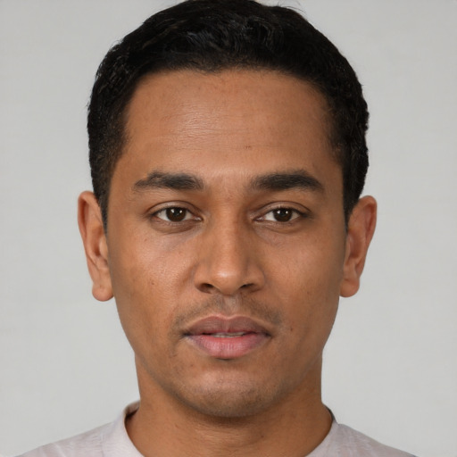 Neutral latino young-adult male with short  black hair and brown eyes