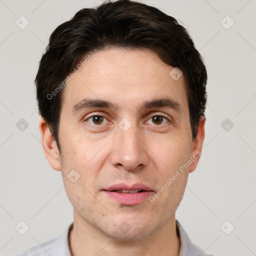 Joyful white adult male with short  brown hair and brown eyes