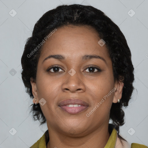 Joyful black adult female with short  brown hair and brown eyes