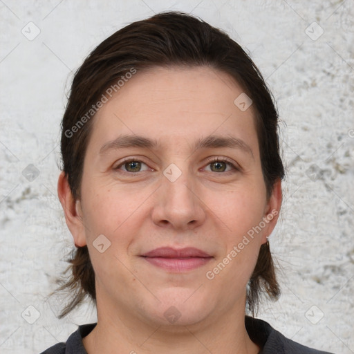 Joyful white adult female with medium  brown hair and grey eyes