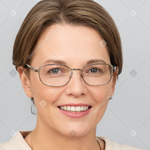 Joyful white adult female with short  brown hair and grey eyes