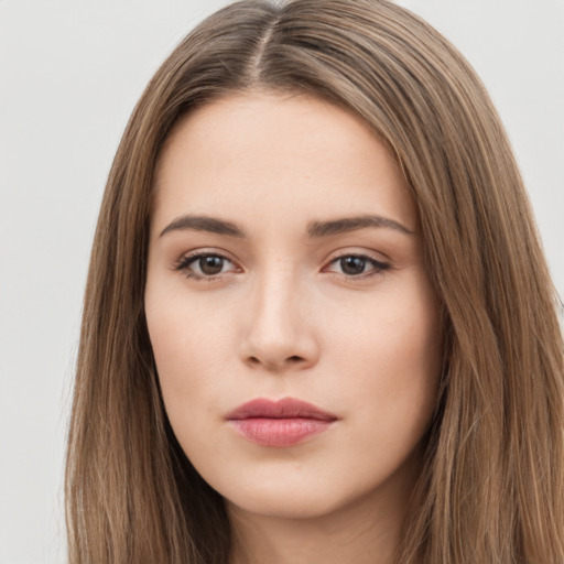 Neutral white young-adult female with long  brown hair and brown eyes