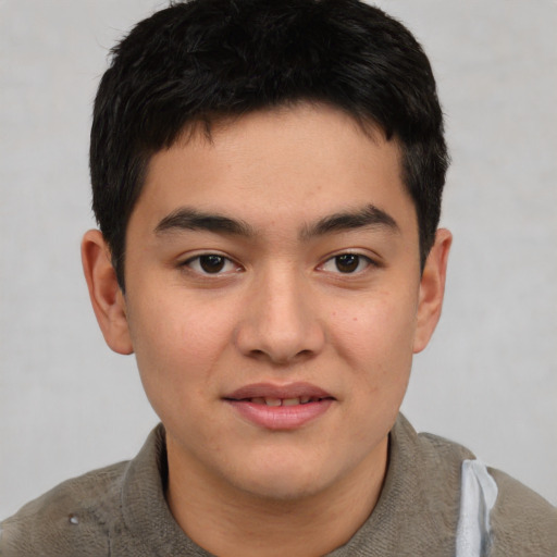 Joyful asian young-adult male with short  brown hair and brown eyes