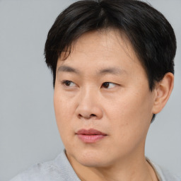 Neutral asian young-adult male with short  black hair and brown eyes