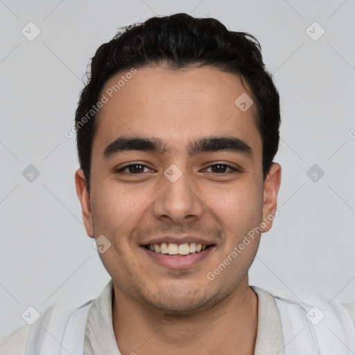 Joyful white young-adult male with short  black hair and brown eyes