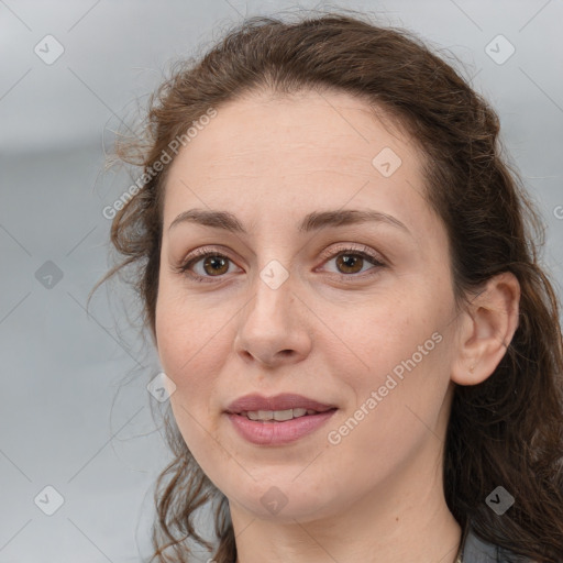 Joyful white adult female with medium  brown hair and grey eyes