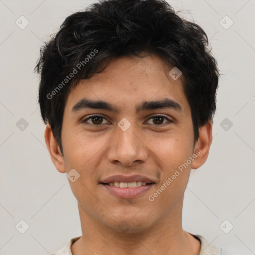 Joyful white young-adult male with short  black hair and brown eyes