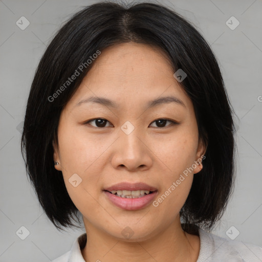 Joyful asian adult female with medium  brown hair and brown eyes