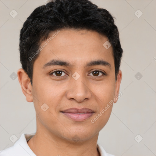 Joyful latino young-adult male with short  brown hair and brown eyes