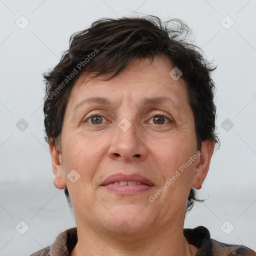 Joyful white adult female with short  brown hair and grey eyes