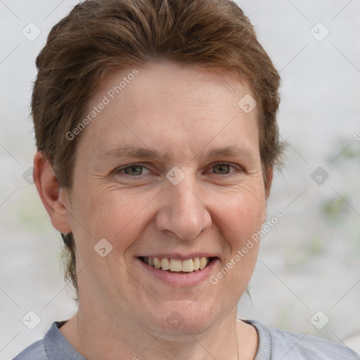 Joyful white adult female with short  brown hair and grey eyes