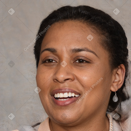 Joyful black adult female with medium  brown hair and brown eyes