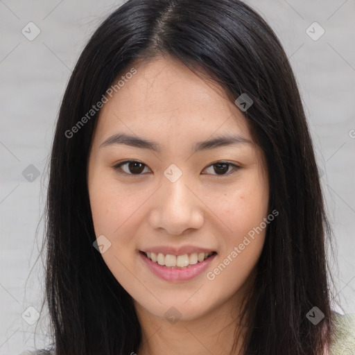 Joyful asian young-adult female with long  brown hair and brown eyes