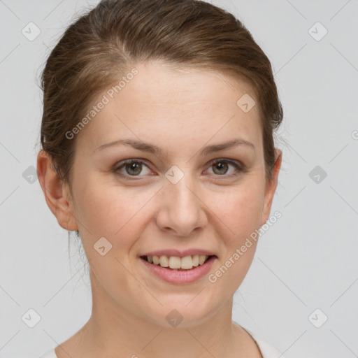 Joyful white young-adult female with short  brown hair and grey eyes