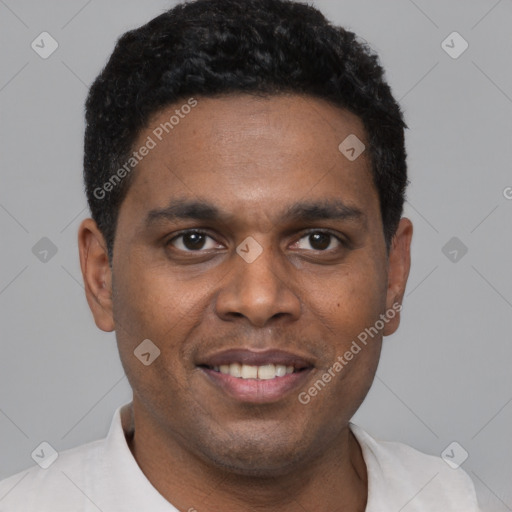 Joyful black young-adult male with short  black hair and brown eyes