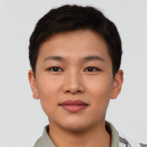 Joyful asian young-adult male with short  brown hair and brown eyes