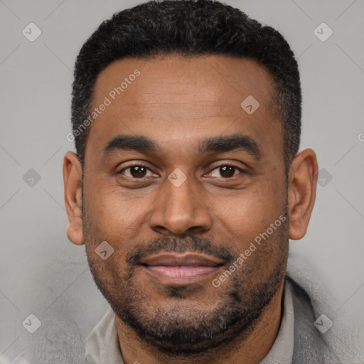 Joyful black young-adult male with short  black hair and brown eyes