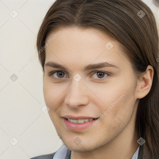 Joyful white young-adult female with long  brown hair and brown eyes