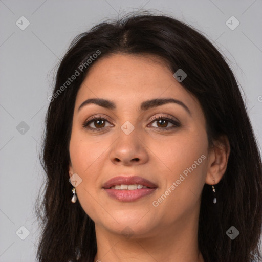 Joyful latino young-adult female with long  brown hair and brown eyes