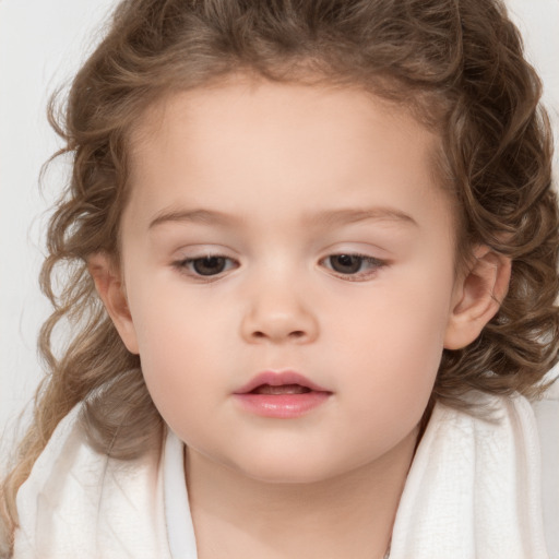 Neutral white child female with medium  brown hair and brown eyes