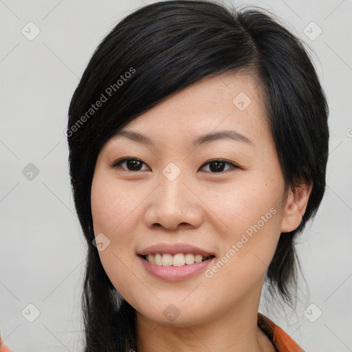 Joyful asian young-adult female with medium  black hair and brown eyes