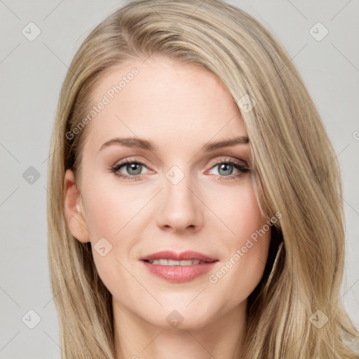 Joyful white young-adult female with long  brown hair and blue eyes