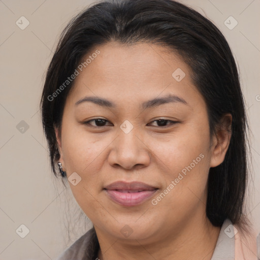 Joyful asian adult female with medium  brown hair and brown eyes