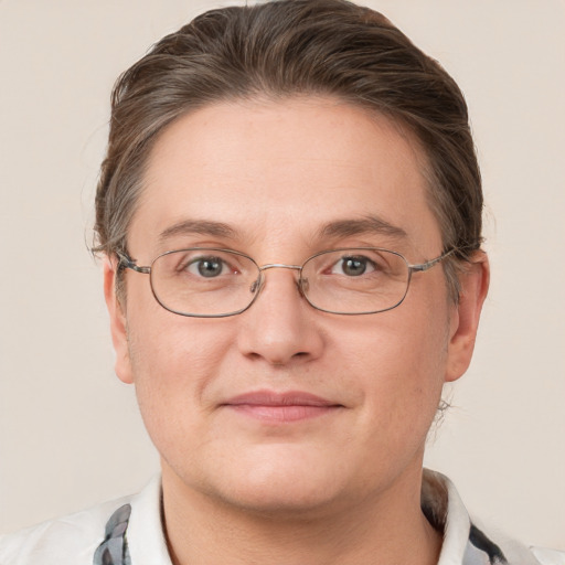 Joyful white adult female with short  brown hair and grey eyes